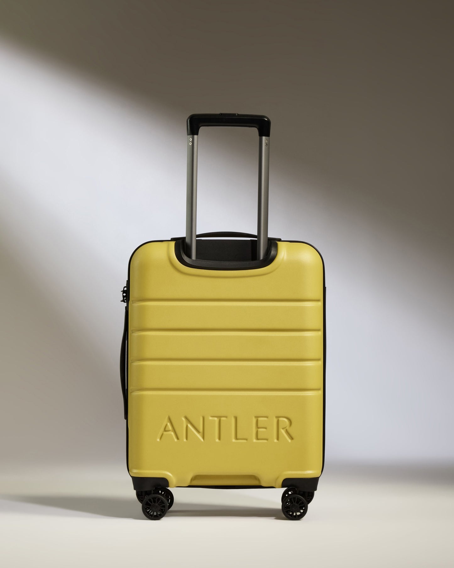 Cabin Suitcase in Mustard Yellow - Logo