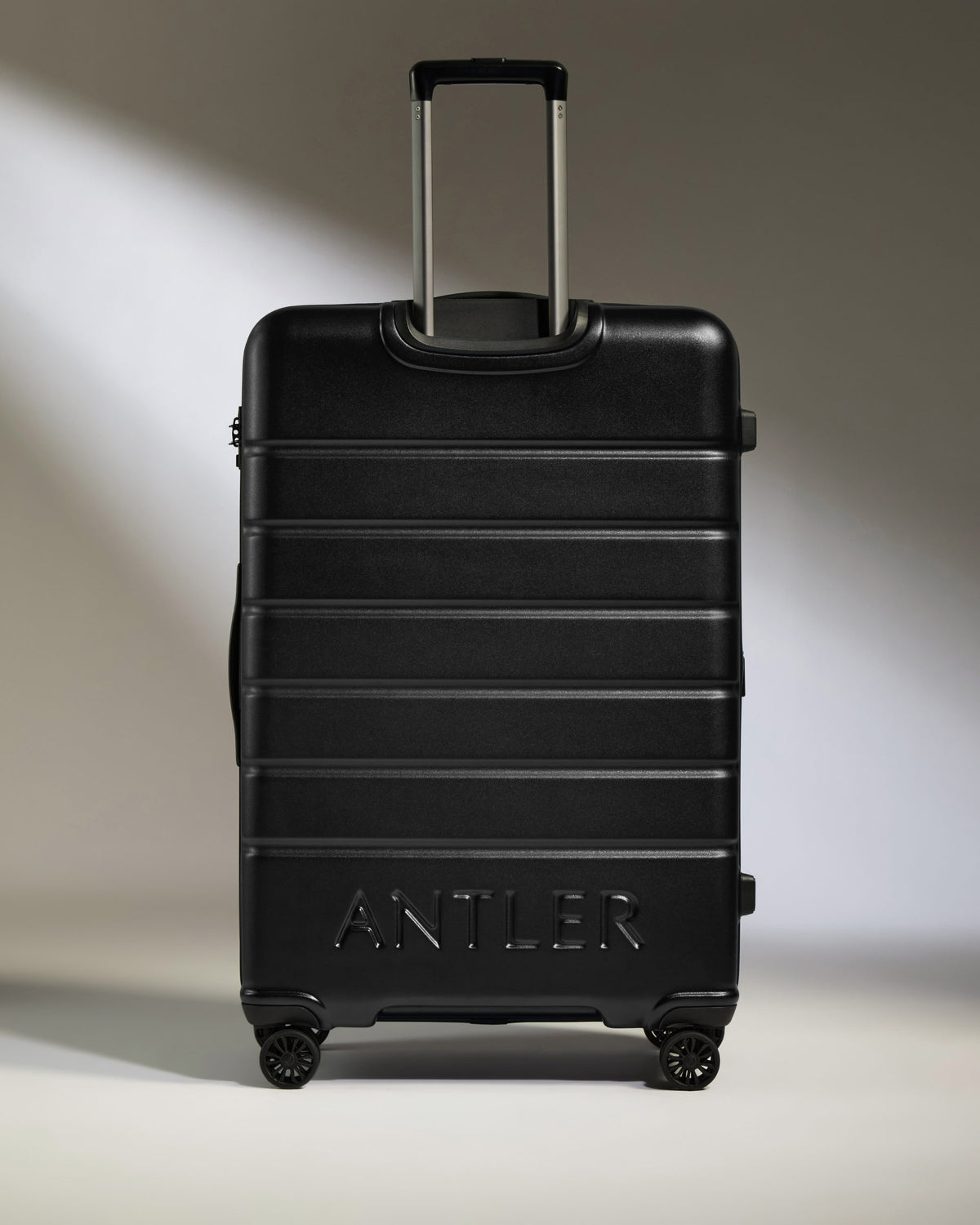 a black suitcase with wheels
