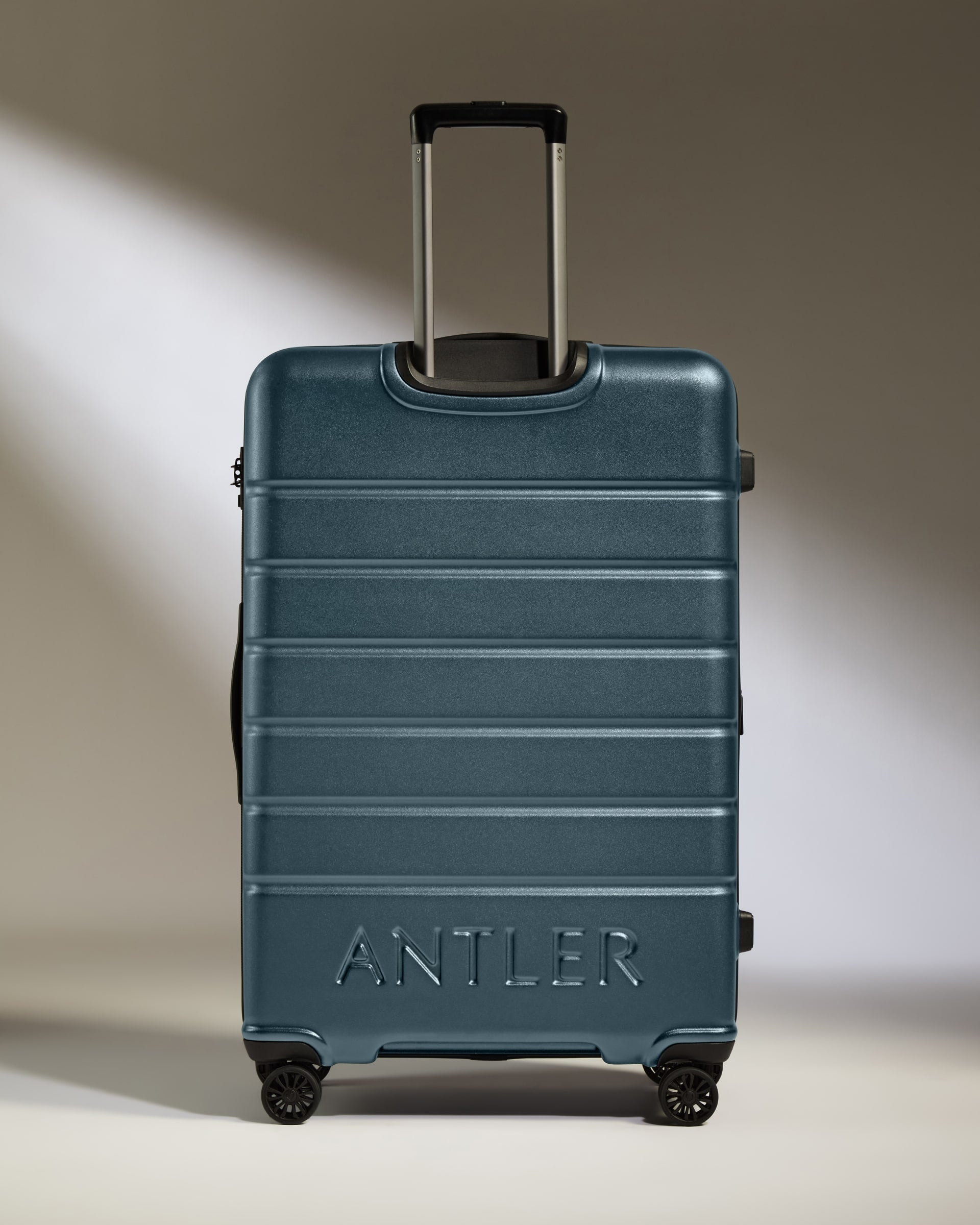 a blue suitcase with handle