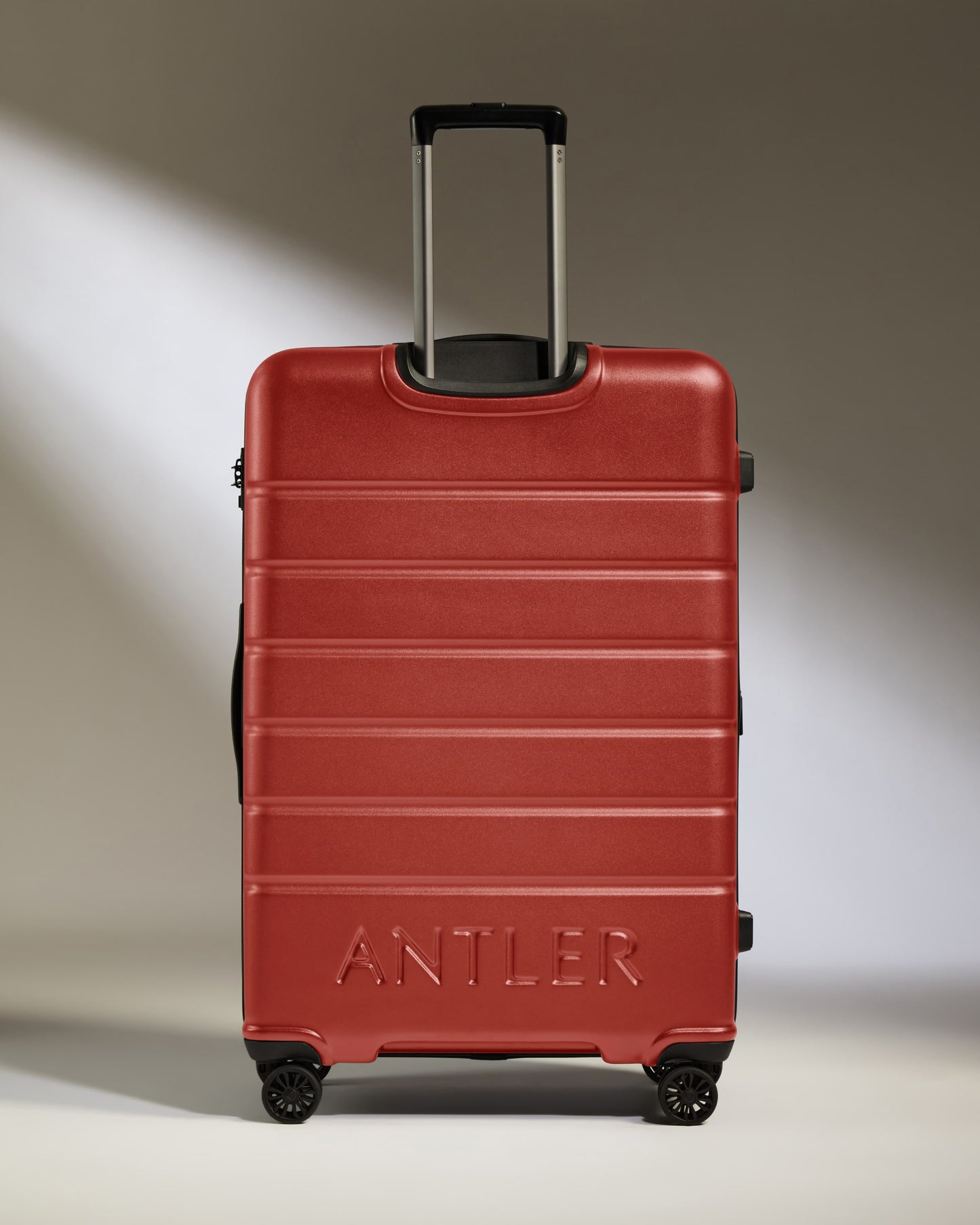 Large Suitcase in Red Orange - Logo