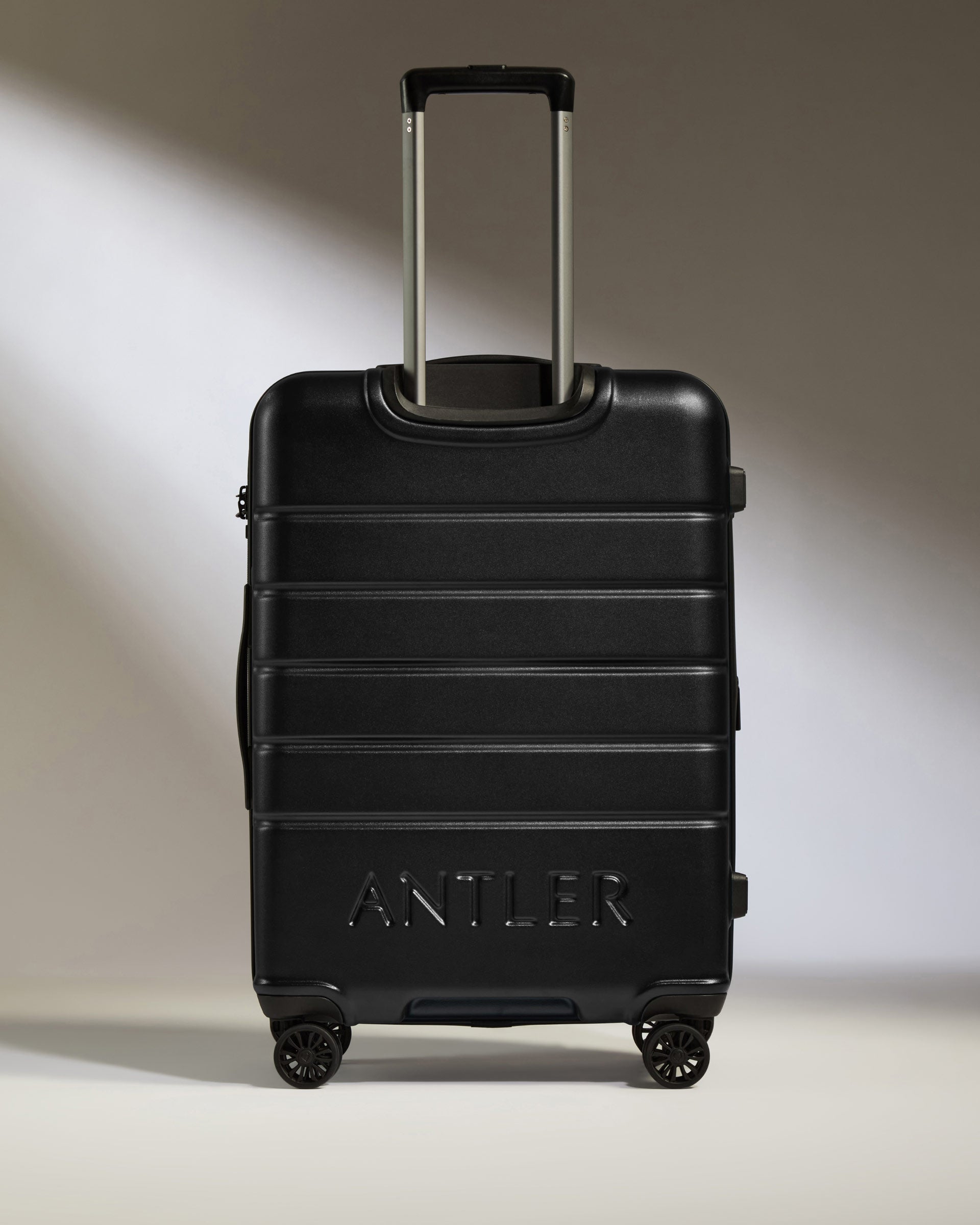 a black suitcase with wheels