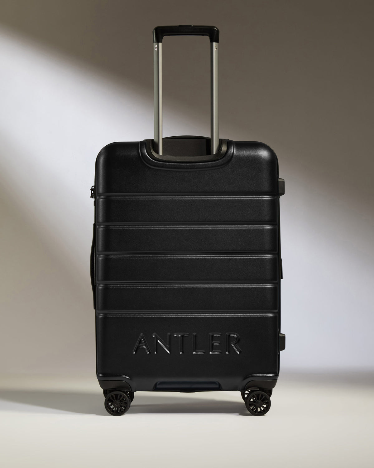 a black suitcase with wheels