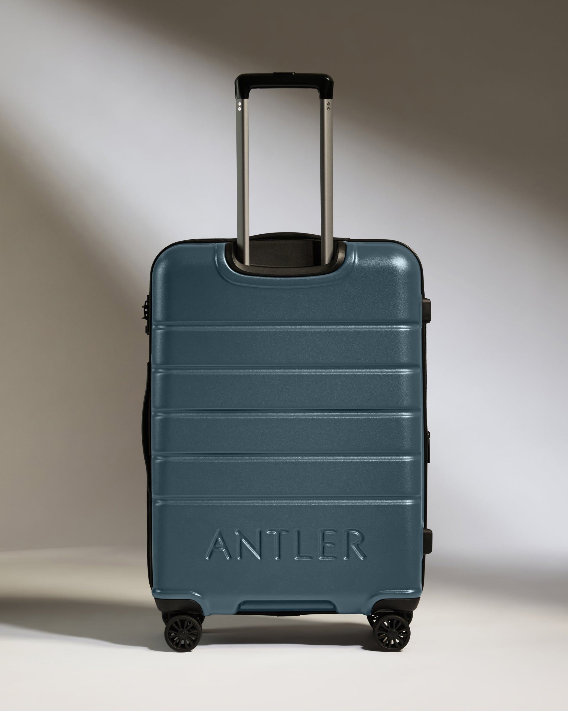 a blue suitcase with handle