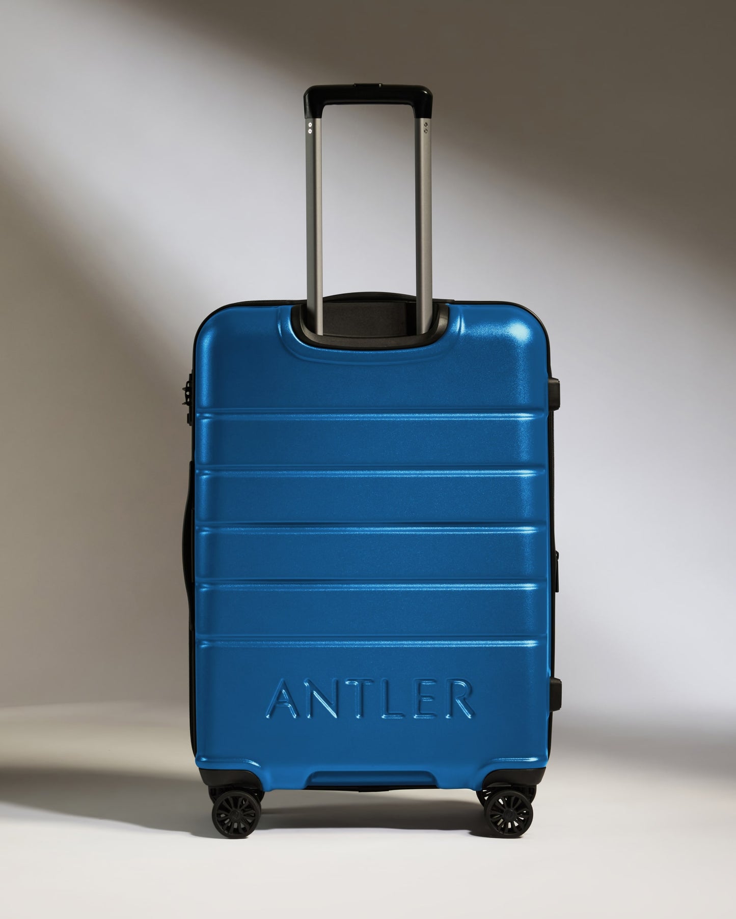 Medium Suitcase in Bold Blue - Logo
