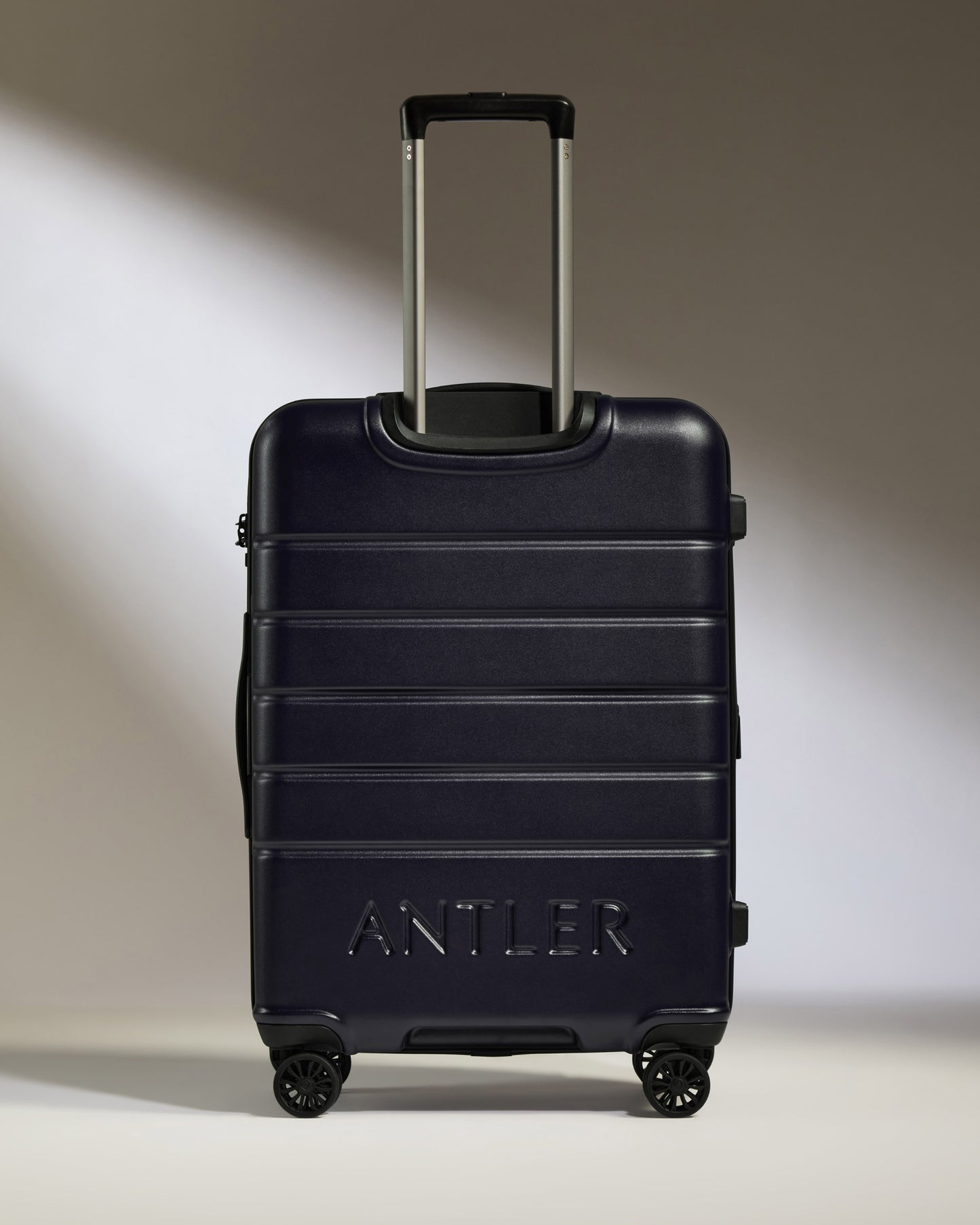 Medium Suitcase in Dark Purple - Logo