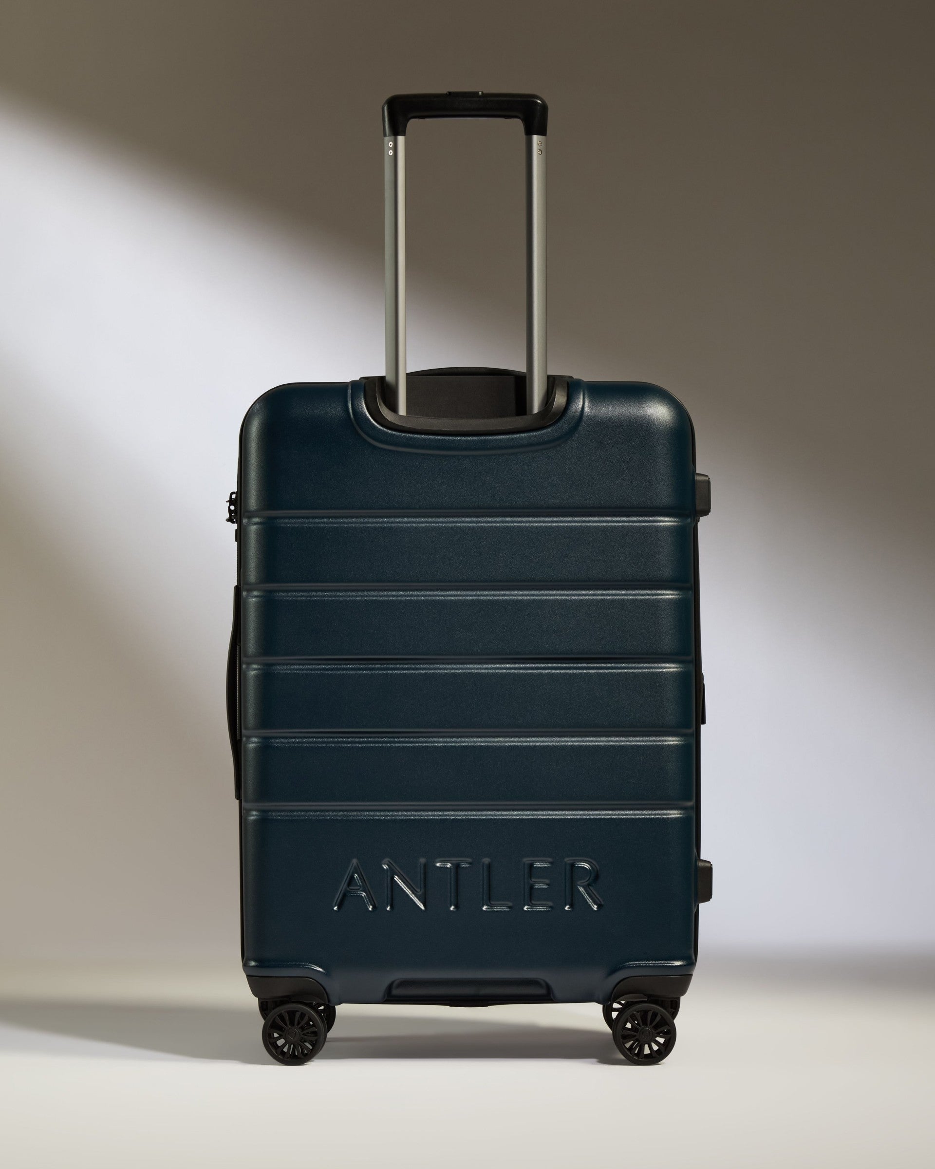 a blue suitcase with handle
