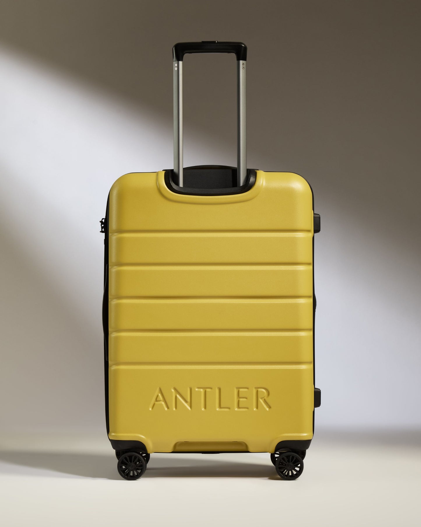 Medium Suitcase in Mustard Yellow - Logo