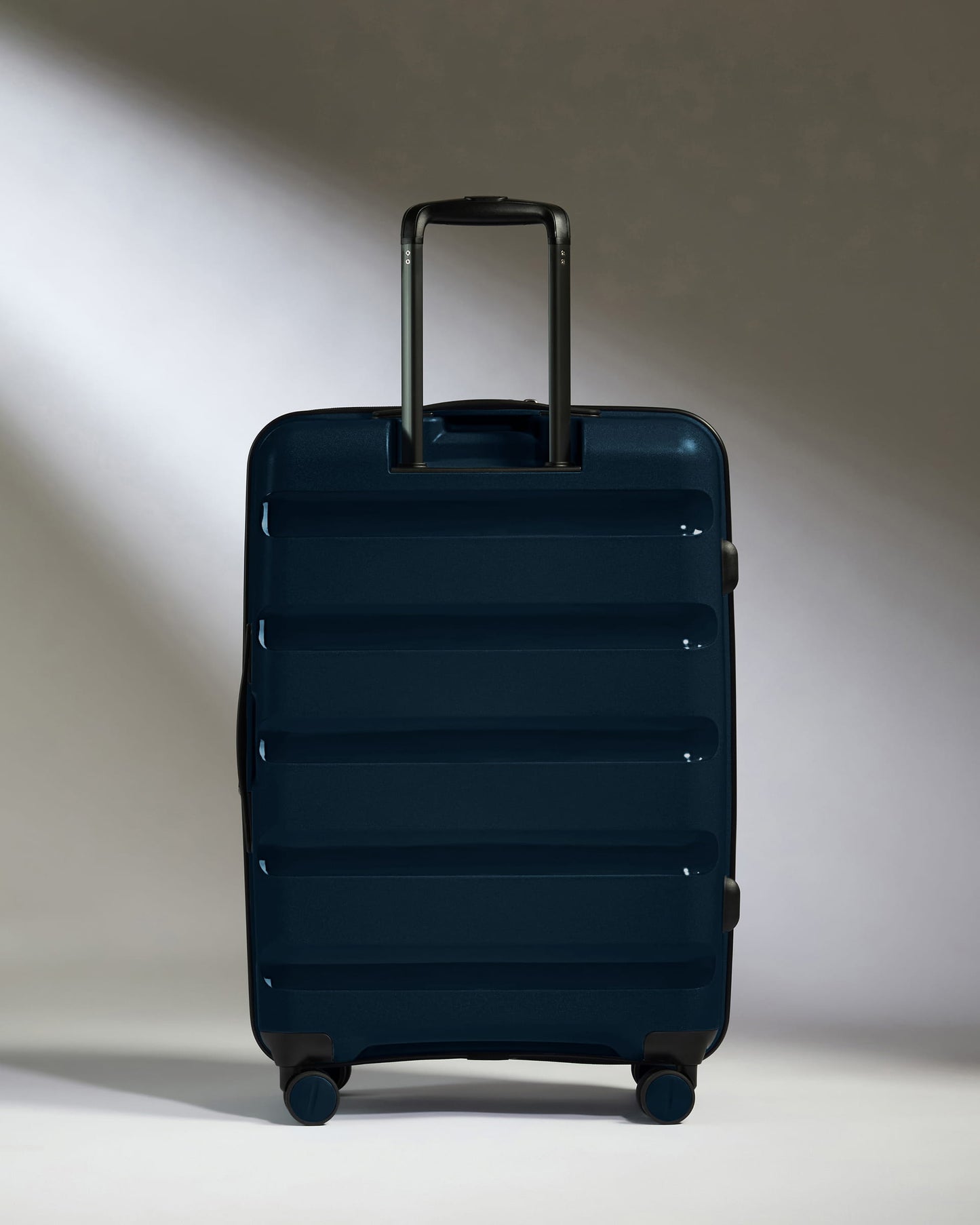 Medium Suitcase in Midnight Blue - Logo Stripe
