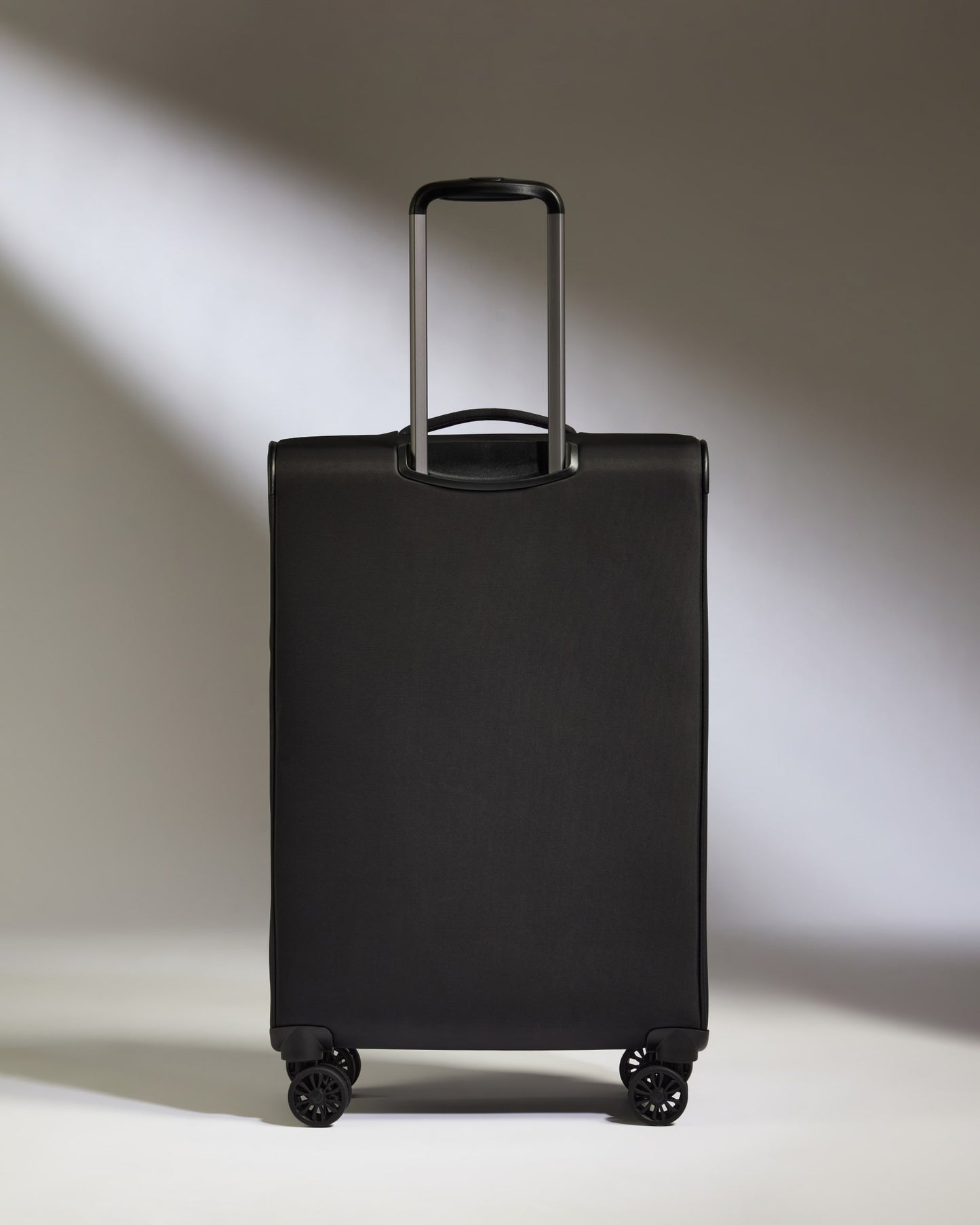Lightest Medium Suitcase in Black - Soft Stripe 2.0