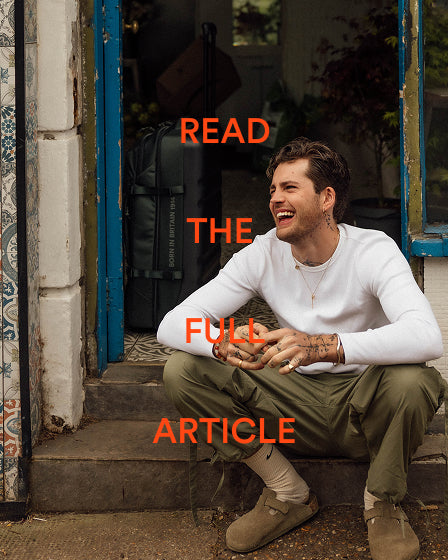 a man sitting on steps smiling