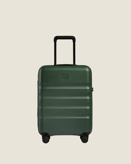 a green suitcase with wheels