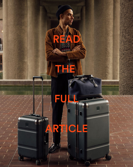 a man standing next to luggage