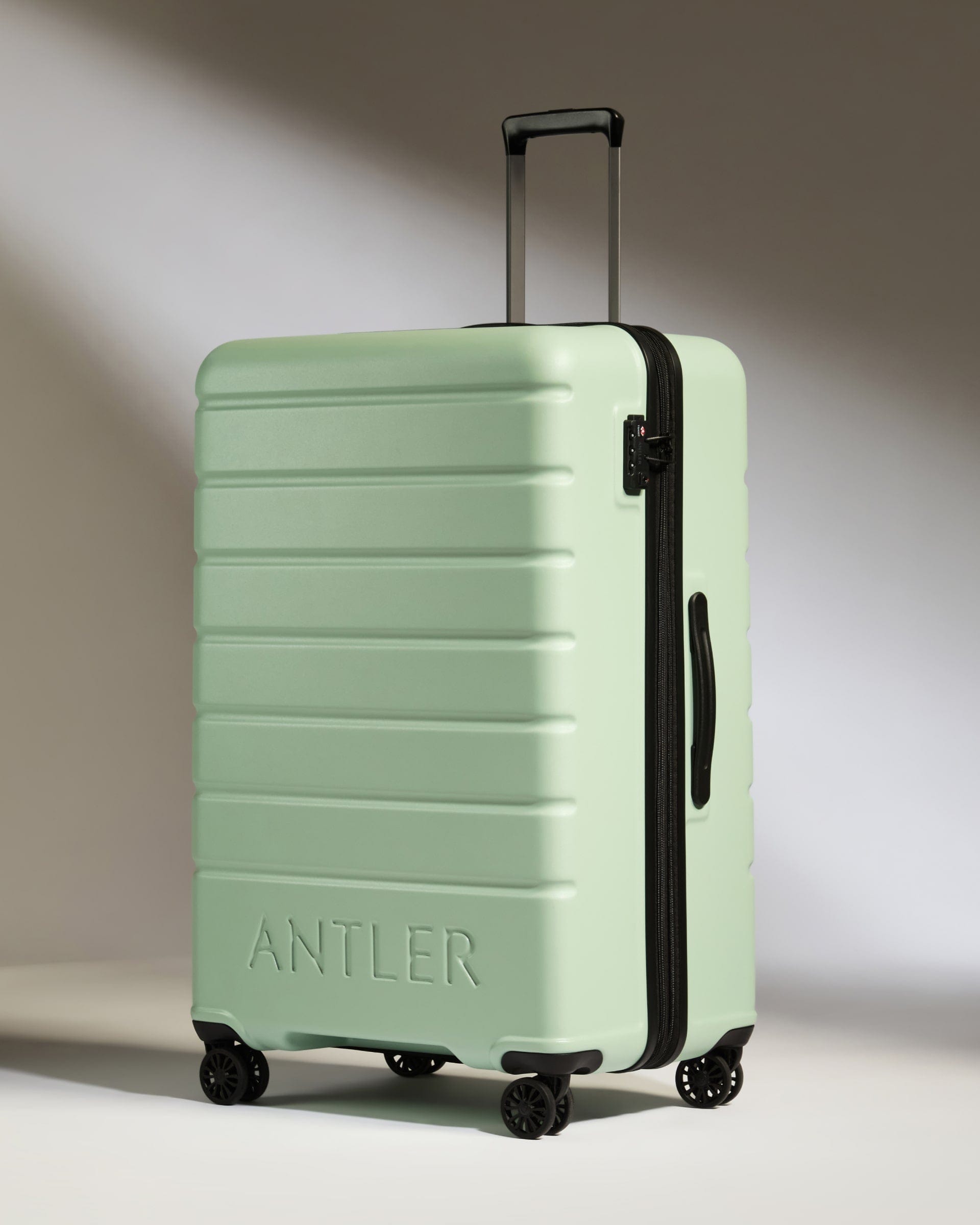 Antler Luggage -  Large Suitcase in Aspen Green - Logo - Hard Suitcases Large Suitcase in Light Green - Logo | Lightweight Hard Shell Luggage