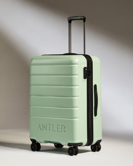 Antler Luggage -  Medium Suitcase in Aspen Green - Logo - Hard Suitcases Medium Suitcase in Light Green - Logo | Lightweight Hard Shell Luggage